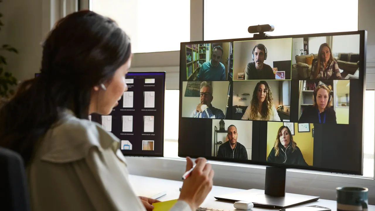 Woman using computer to conduct a video meeting